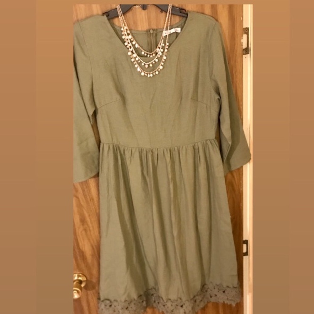 A Stevie Hender green dress past the knee length